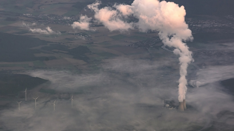 Photo of nuclear power plant and wind turbines