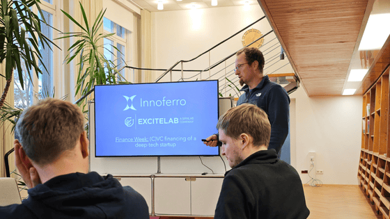 A man is presenting a pitch with slides