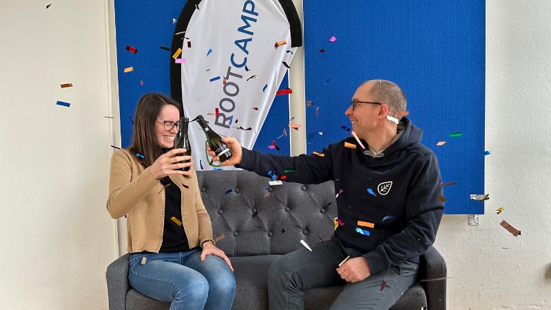 A photo of Gaia and Philipp celebrating the funding news with confetti and wine