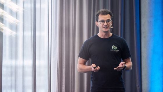 a photo of magnotherm founder speaking to an audience