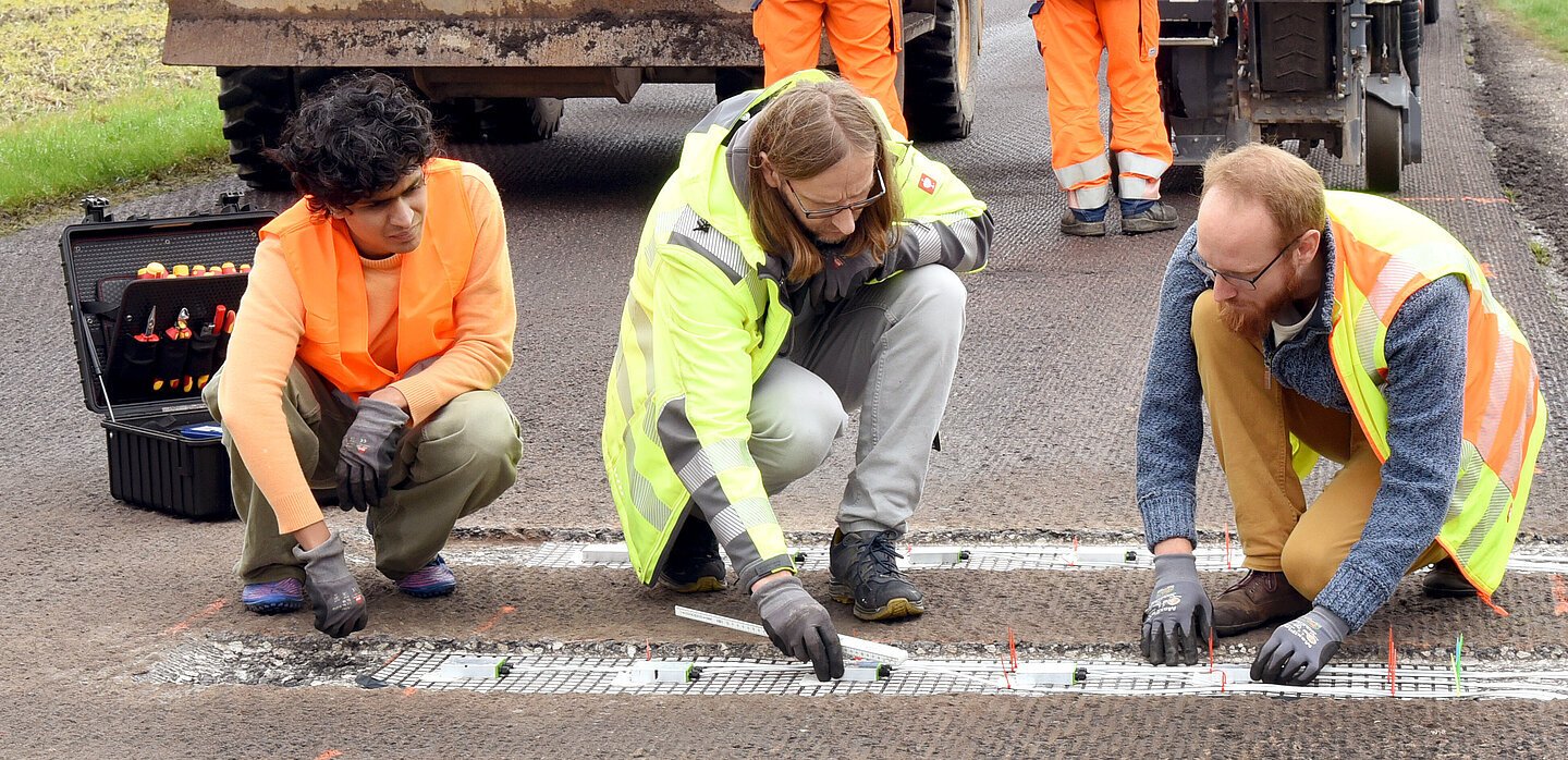 photo of an employer on the road measuring