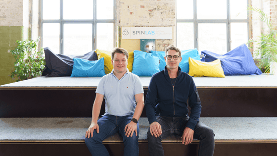 Photo of the founding team of Deftpower, two men sitting and looking into the camera